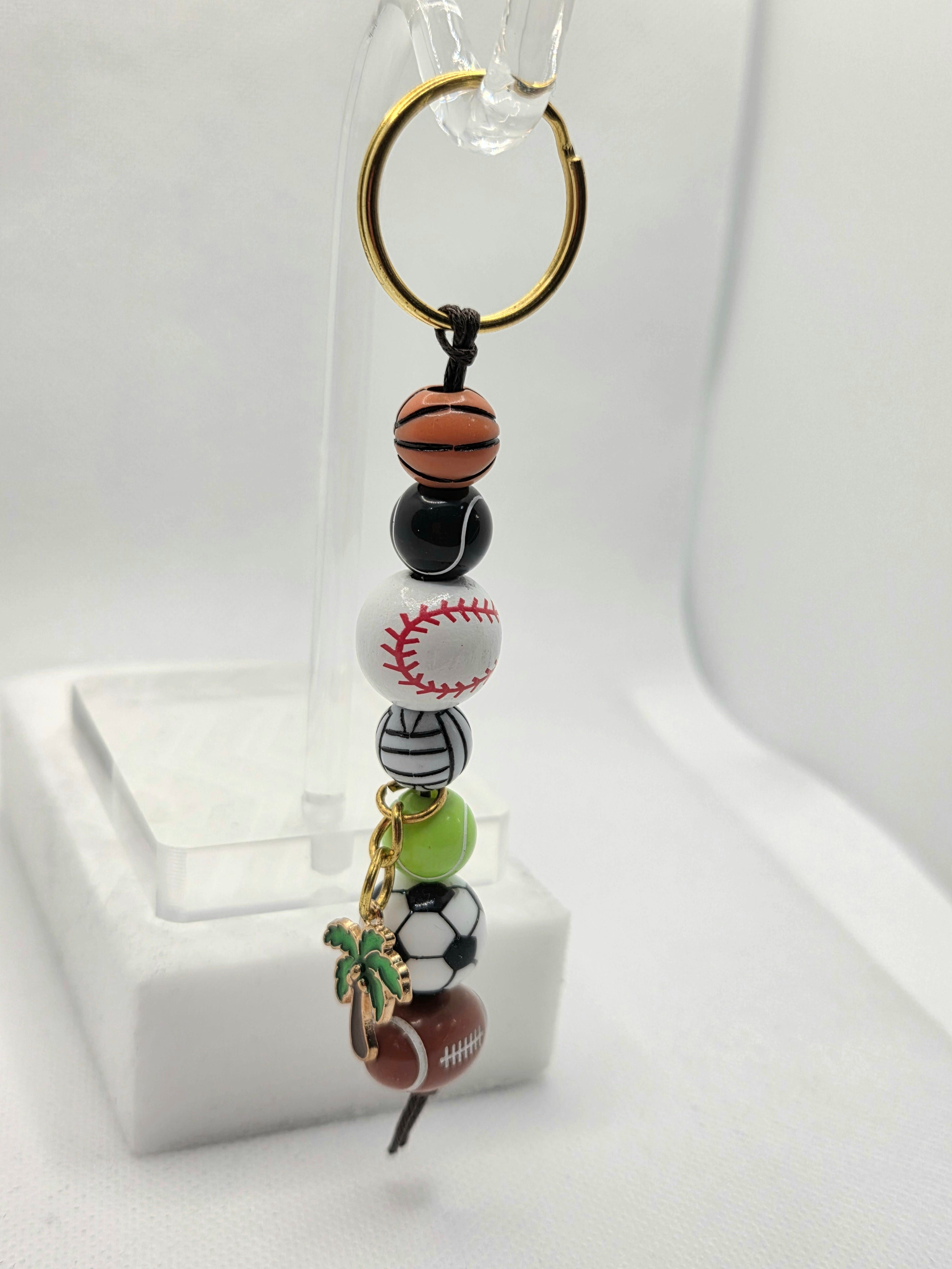 Keychain with sports-themed beads on a white background